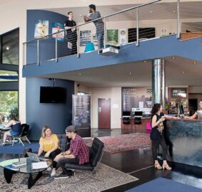 Two people sitting in the hall