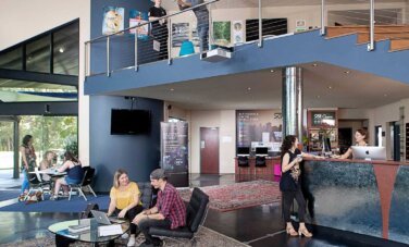 Two people sitting in the hall