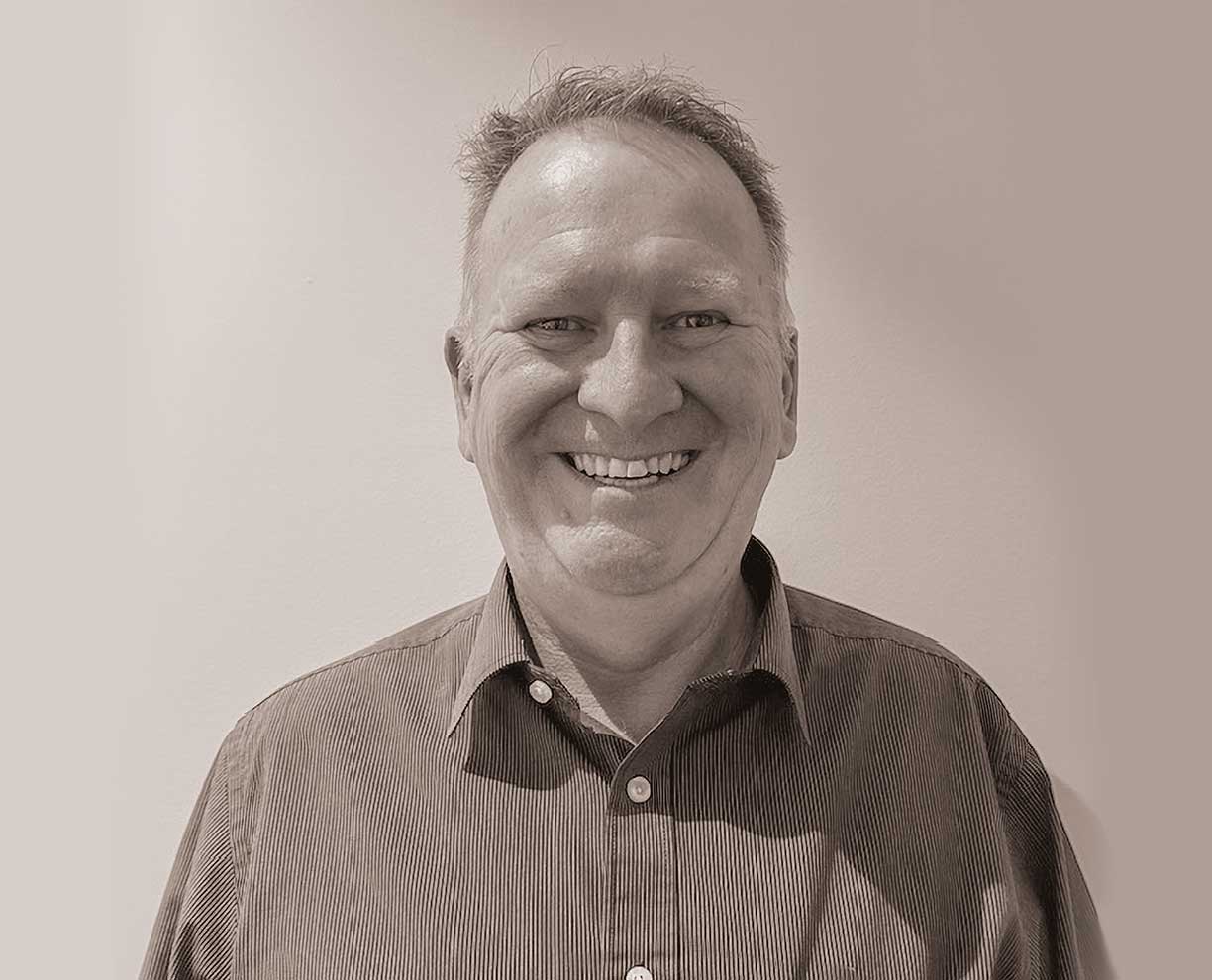 Headshot of man. Portrait of Campus Manager Derek Milligan