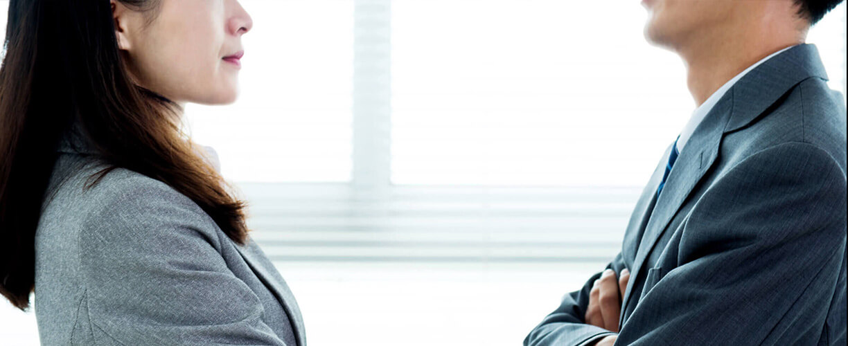 Close up of man and woman facing each other.