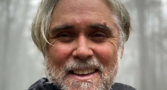 Profile picture of a man in a forest.