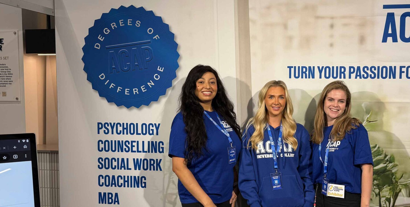 Three course advisors standing at the ACAP University College booth of the Sydney HSC & Careers Expo (2880x1188)
